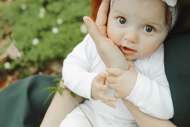 Little girl is happy in the arms of my mother