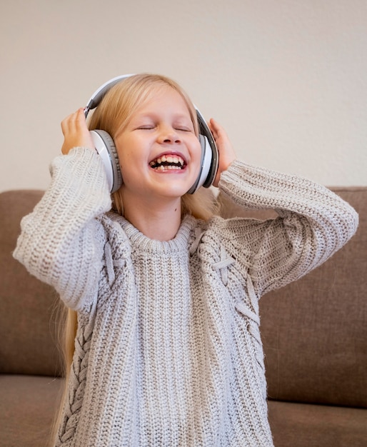 Little girl listening to music concept