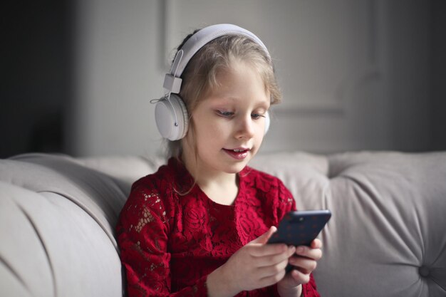 Little girl listens to music