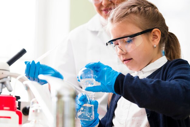 Little girl mixing substances