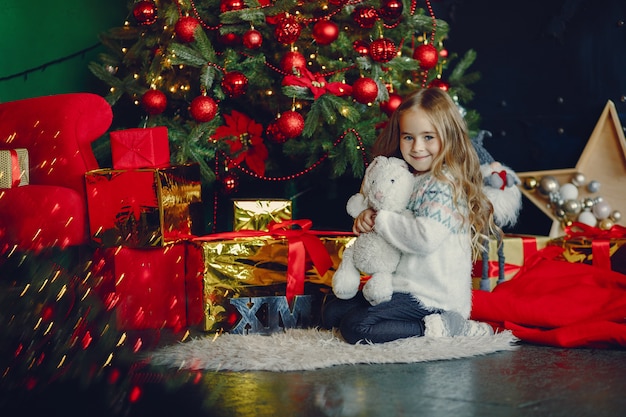 Little girl near christmas trre