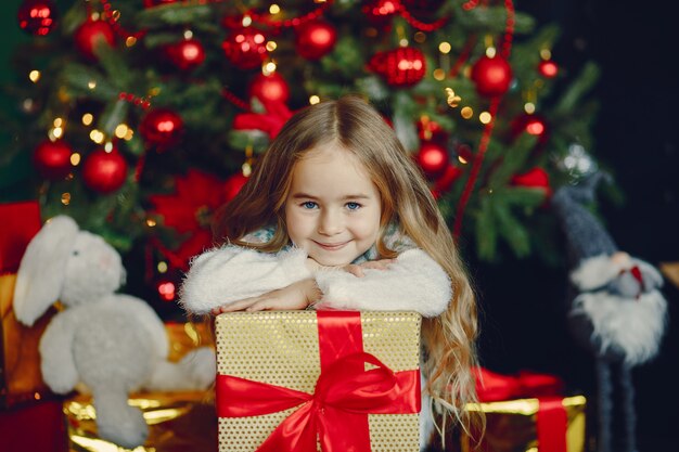 Little girl near christmas trre