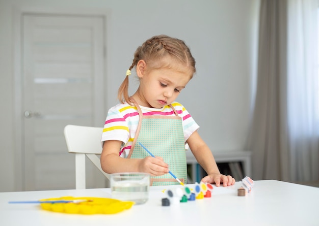 Little girl painting