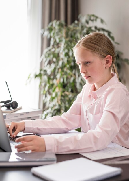 Little girl participating in online class