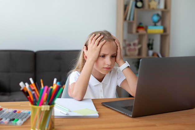 Little girl participating in online classes