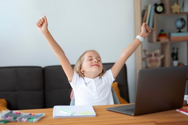 Little girl participating in online classes