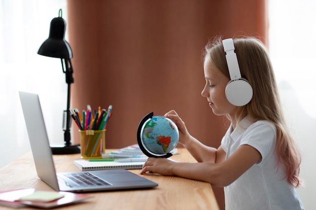 Little girl participating in online classes