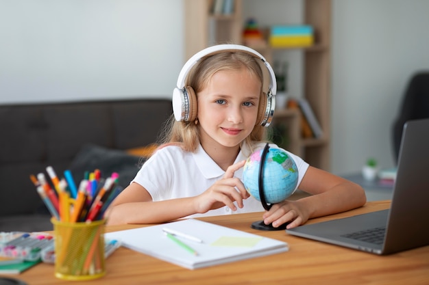 Little girl participating in online classes Free Photo