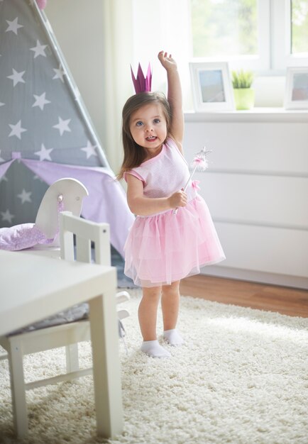 Little girl playing at her room