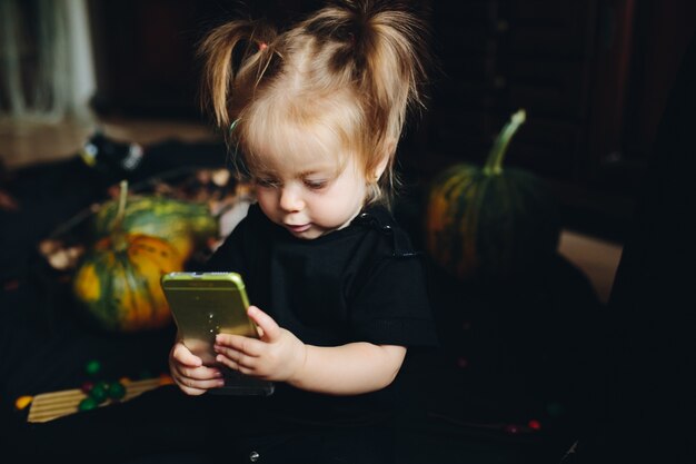 Little girl playing with mobile