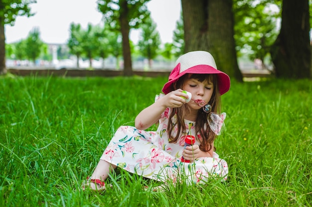 Little girl playing with a pompous