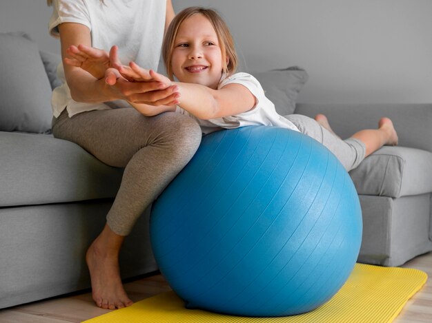 Little girl practising on ball