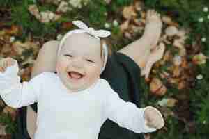 Free photo little girl rejoices in her mother's arms