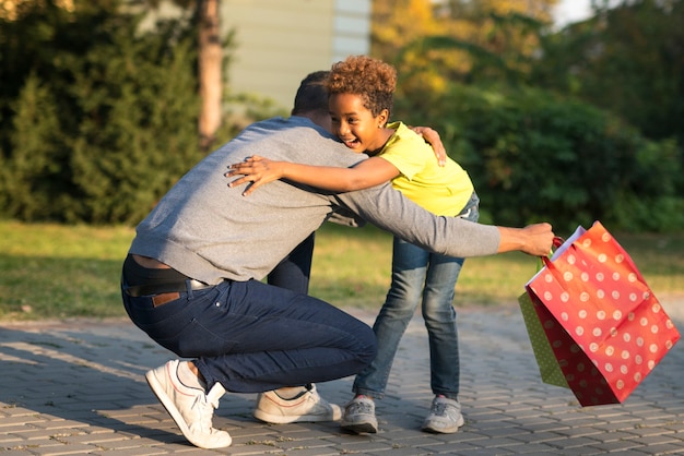 Free photo little girl running into her father's arms