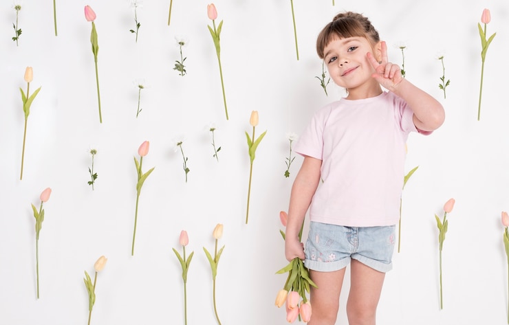 Free Photo little girl showing peace sign