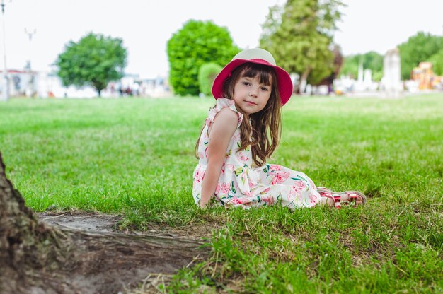 Little girl sitting on the floor