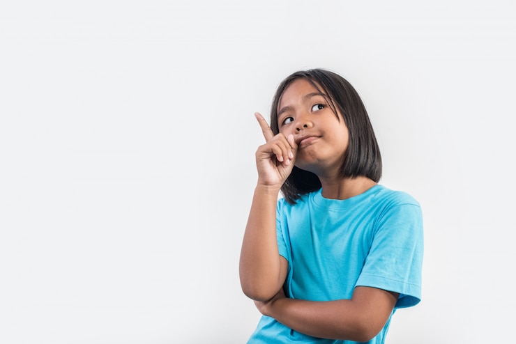 Free Photo little girl thinking in studio shot