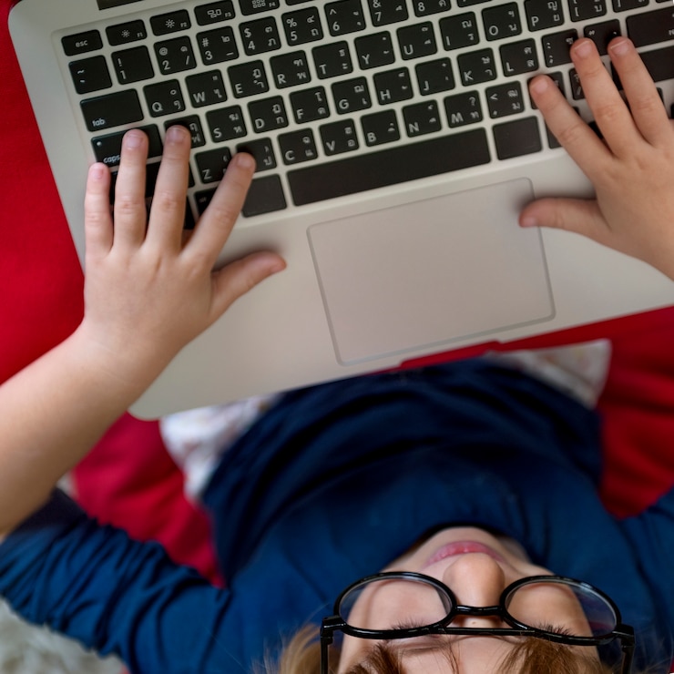 Free Photo little girl using device concept