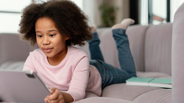 Little girl using tablet