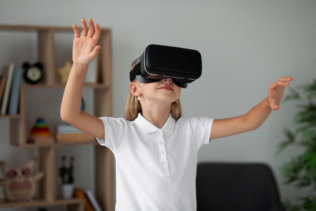 Little girl using virtual reality goggles