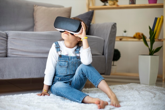 Little girl wearing vr goggles