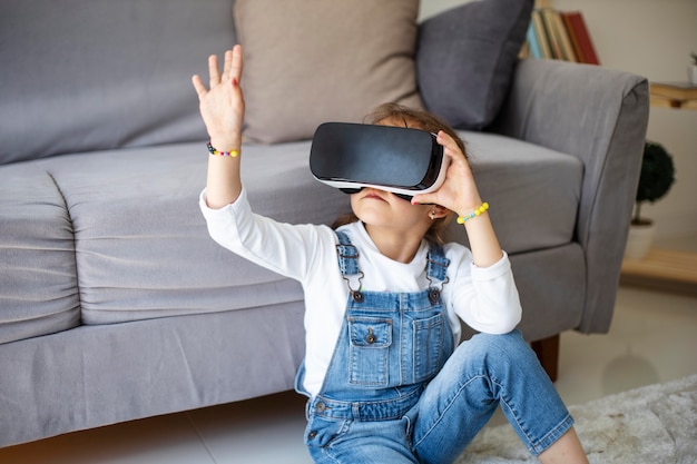 Little girl wearing vr goggles