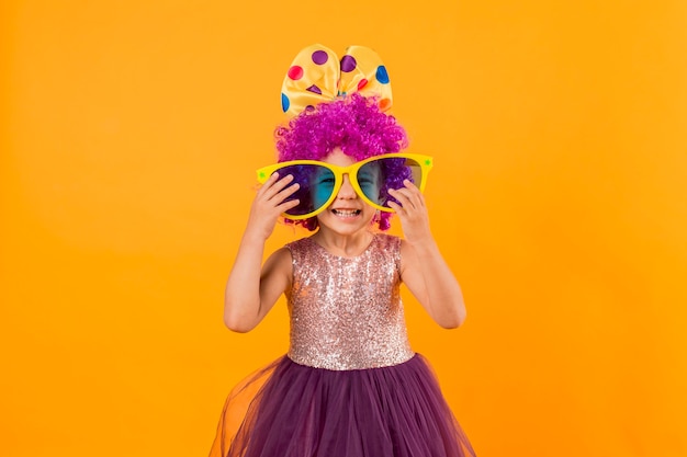 Little girl with big sunglasses and tutu