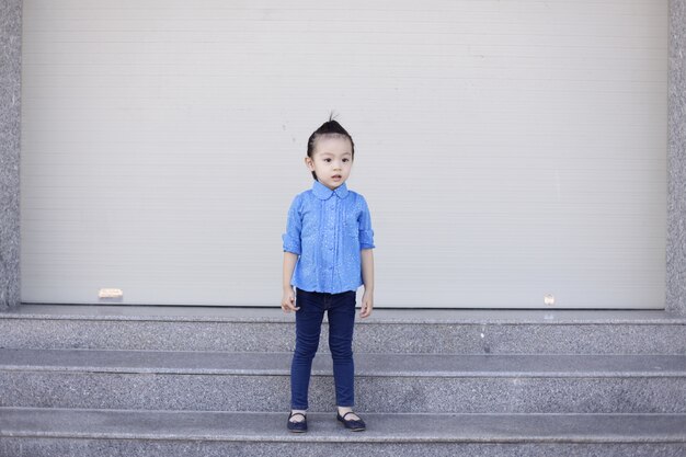 Little girl with denim clothes