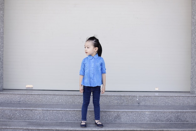 Little girl with denim clothes