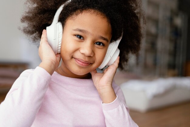little girl with headphones