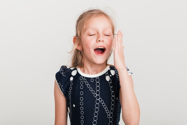 Free photo little girl with tired expression