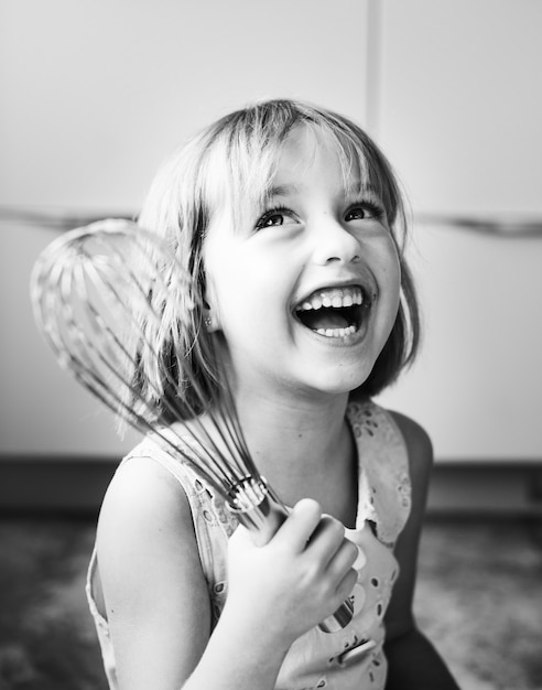 Little girl with a whisk