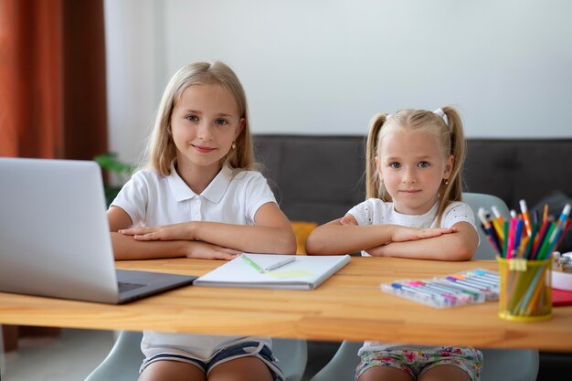 Little girls doing online school together