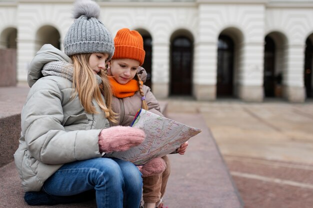 Little girls enjoying a trip on their familiar holidays