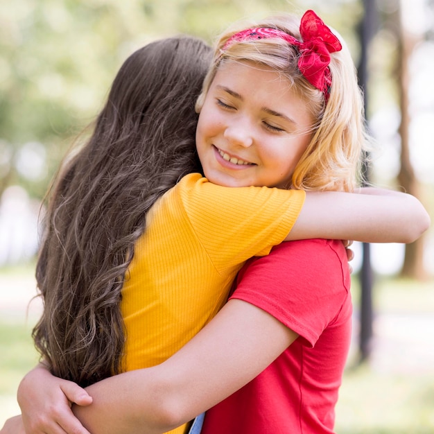 Little girls hugging on childrens day