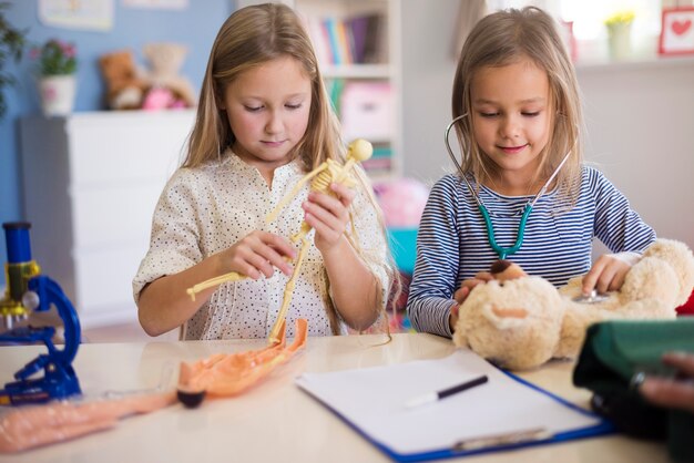 Little girls pretending to be a professional doctor