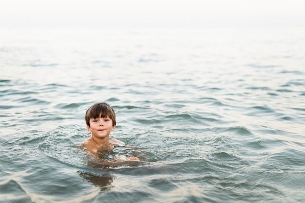 Little kid posing in the sea