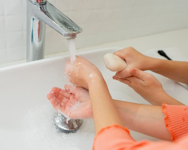 Little kids washing their hands