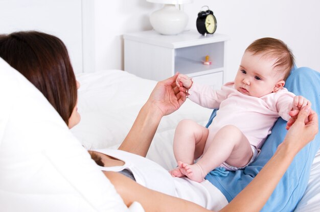 Little newborn baby playing