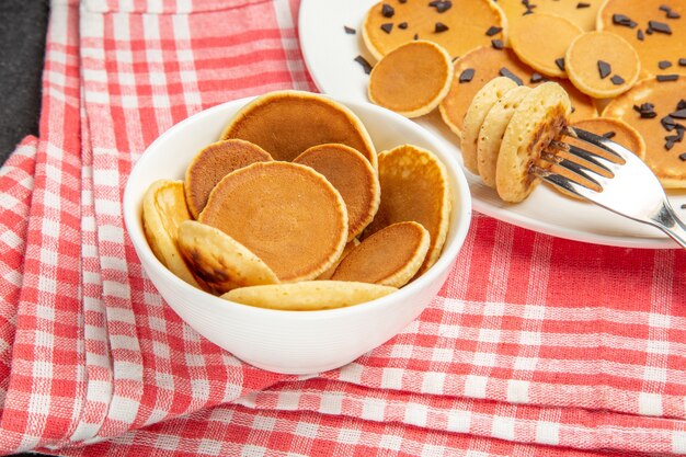 little pancakes with choco chips on dark