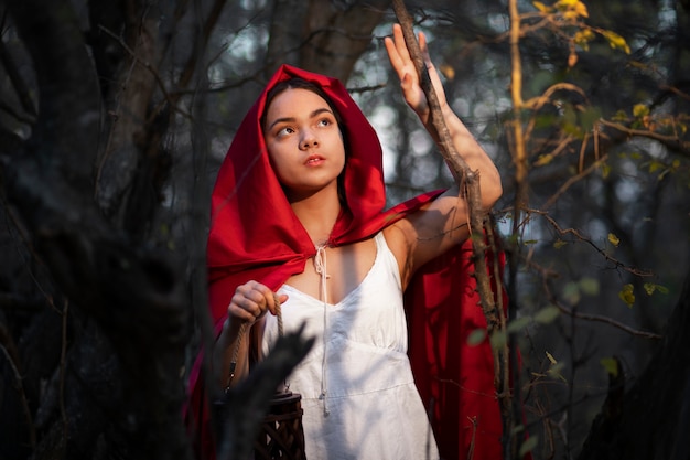 Little red riding hood in the forest portrait