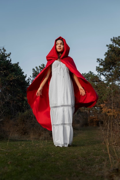 Little red riding hood in a white dress