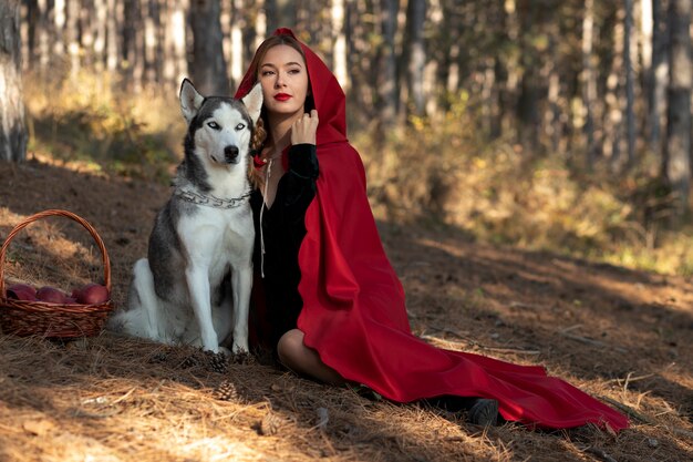 Little red riding hood with adorable husky