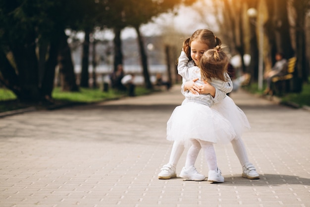 Little sisters in park