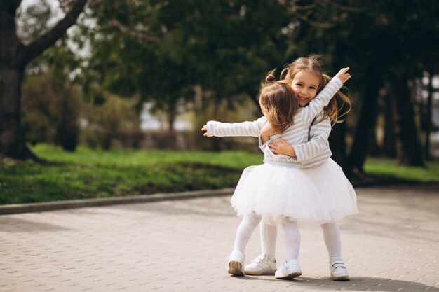 Little sisters in park