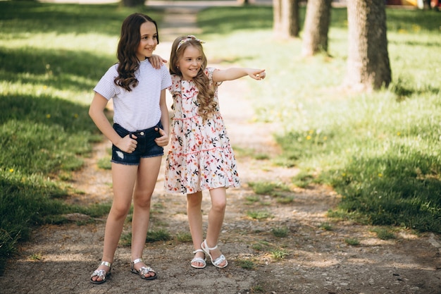 Little sisters in park