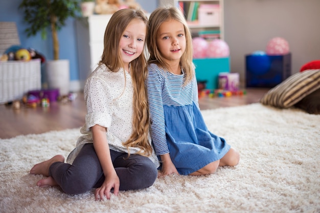 Little sisters in their bedroom