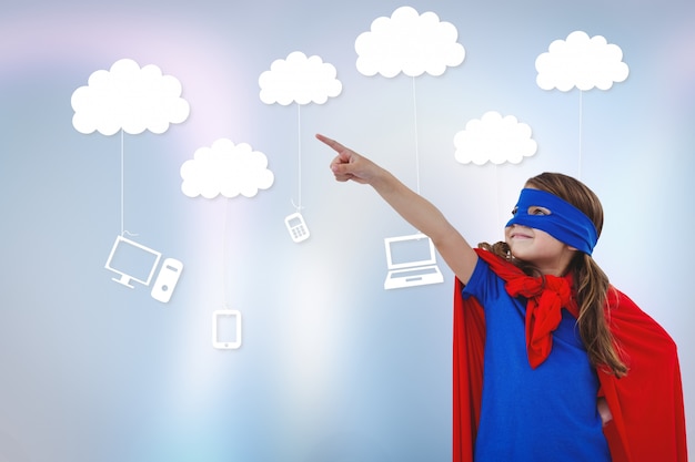 Free photo a little superhero with technological clouds