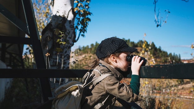 Little traveller with binoculars