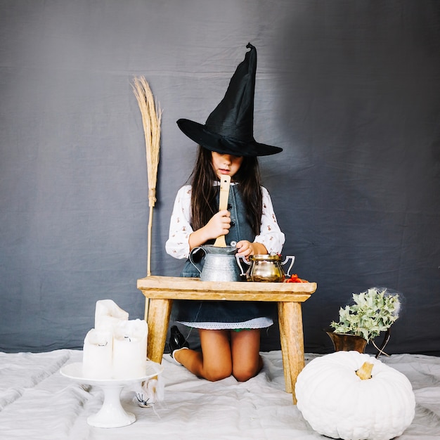 Free photo little witch brewing potion